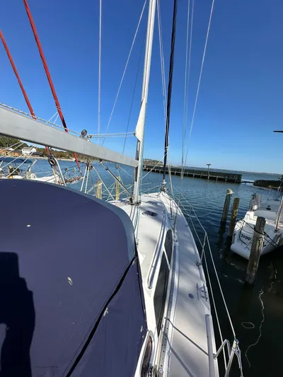 Chesapeake Free Yacht Photos Pics 2006 Catalina 387 sailboat docked at a marina under clear blue skies.