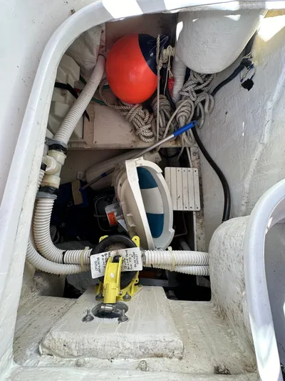 Chesapeake Free Yacht Photos Pics Storage compartment of a 2006 Catalina 387 sailboat with ropes, buoy, and equipment.