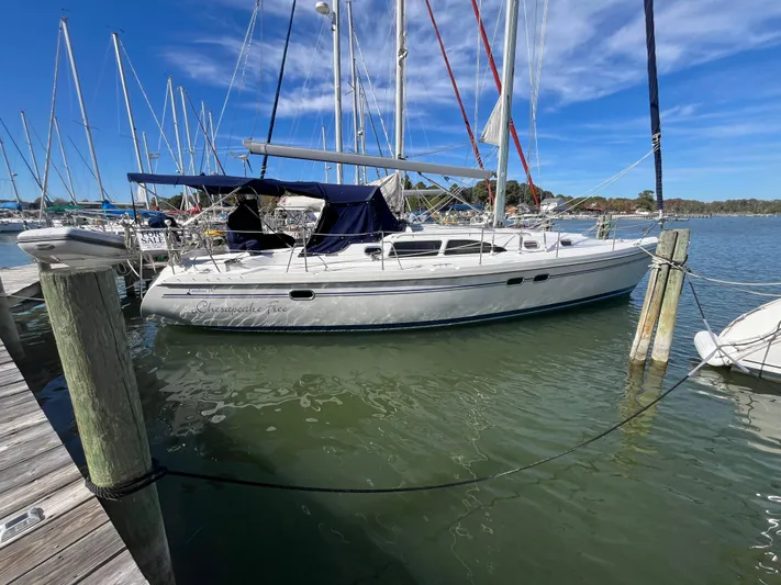 Chesapeake Free Yacht Photos Pics 2006 Catalina 387 sailboat docked at marina under clear blue sky.