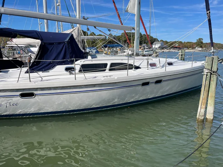 Chesapeake Free Yacht Photos Pics Sailboat Catalina 387, 2006 model, docked in a marina with blue canopy.