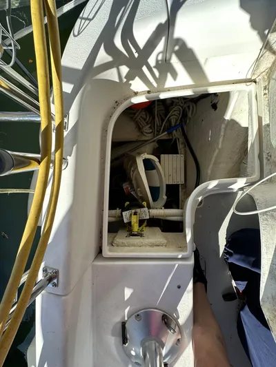 Chesapeake Free Yacht Photos Pics Open compartment on 2006 Catalina 387 sailboat deck, showing cables and equipment.