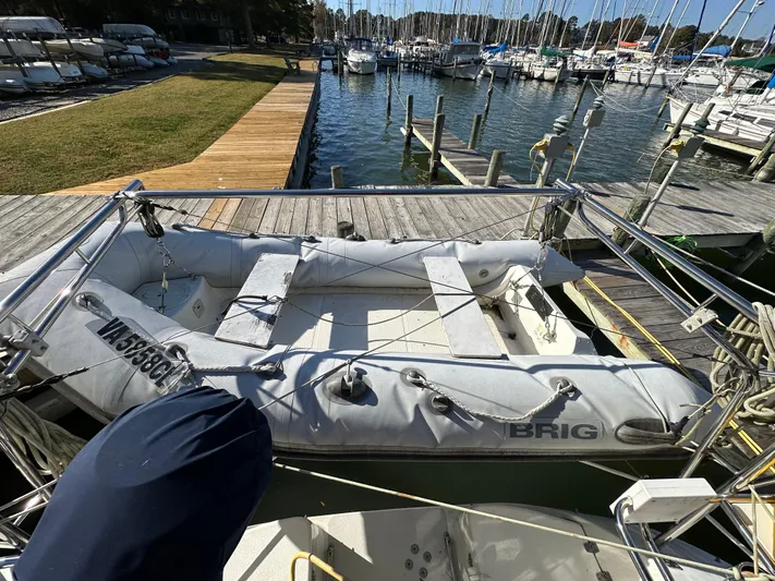 Chesapeake Free Yacht Photos Pics Inflatable boat docked near a Catalina 387 sailboat, 2006 model, in a marina.