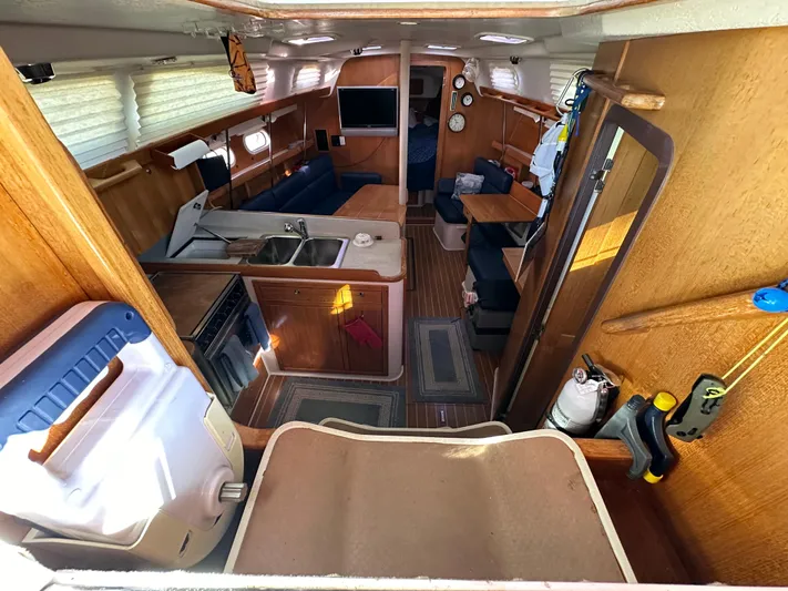 Chesapeake Free Yacht Photos Pics 2006 Catalina 387 yacht interior with kitchen, seating area, and wooden finishes.