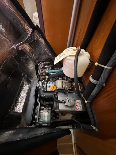 Chesapeake Free Yacht Photos Pics Engine compartment of a 2006 Catalina 387 sailboat, featuring mechanical components and wiring.