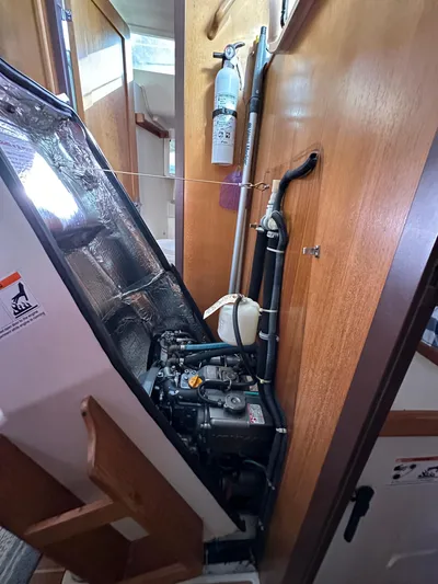 Chesapeake Free Yacht Photos Pics Engine compartment of a 2006 Catalina 387 sailboat with fire extinguisher.