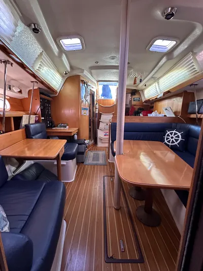 Chesapeake Free Yacht Photos Pics Interior of 2006 Catalina 387 sailboat with wooden flooring and blue seating.