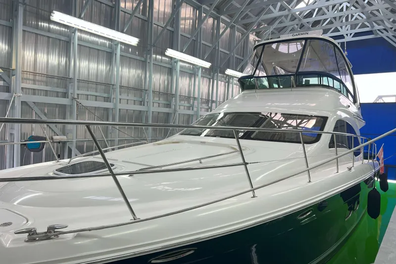 Elisabeth Jane Yacht Photos Pics 2008 Sea Ray 52 Sedan Bridge yacht in a well-lit indoor storage facility.