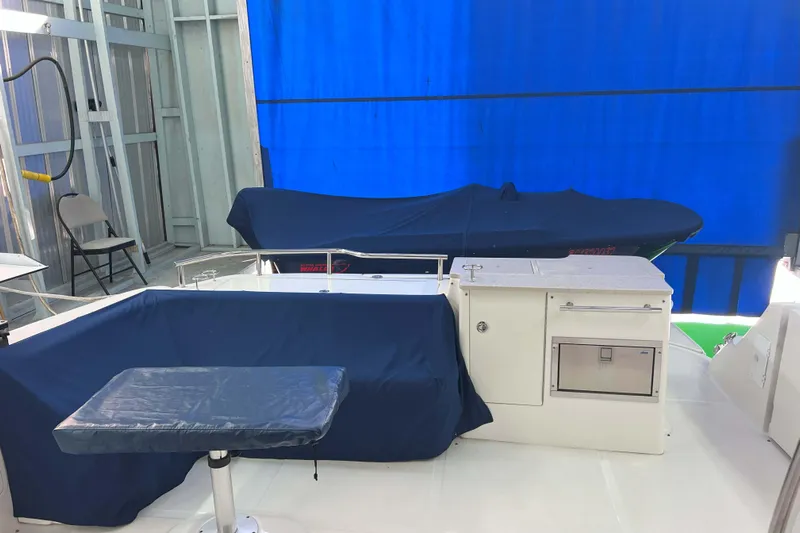 Elisabeth Jane Yacht Photos Pics 2008 Sea Ray 52 Sedan Bridge yacht interior with blue covers and storage area.