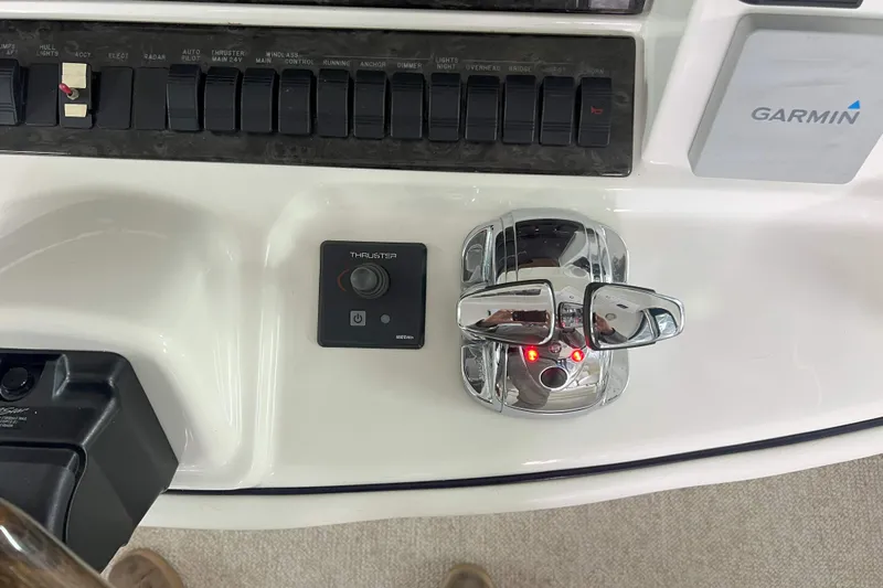 Elisabeth Jane Yacht Photos Pics Control panel of a 2008 Sea Ray 52 Sedan Bridge with thruster and Garmin system.