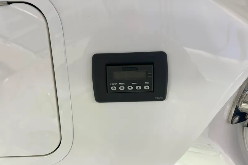 Elisabeth Jane Yacht Photos Pics Control panel on 2008 Sea Ray 52 Sedan Bridge yacht, featuring power, mode, temperature, and fan buttons.