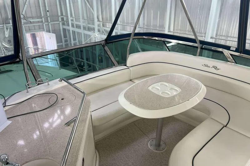 Elisabeth Jane Yacht Photos Pics Luxurious interior of 2008 Sea Ray 52 Sedan Bridge yacht with elegant seating and table.