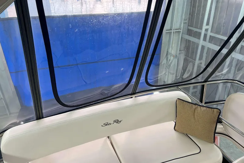 Elisabeth Jane Yacht Photos Pics Interior of 2008 Sea Ray 52 Sedan Bridge with cushioned seating and pillow.
