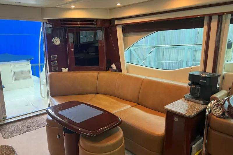Elisabeth Jane Yacht Photos Pics Luxurious interior of 2008 Sea Ray 52 Sedan Bridge yacht with leather seating and coffee maker.