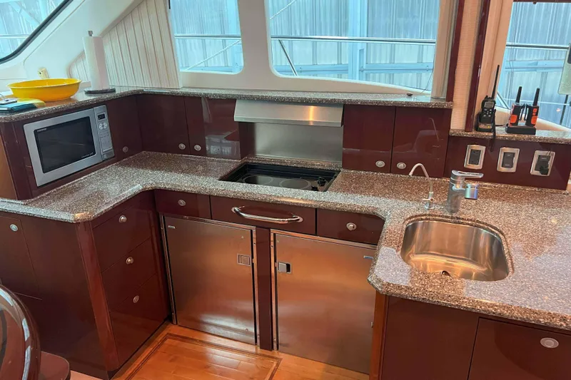 Elisabeth Jane Yacht Photos Pics Luxurious kitchen interior of 2008 Sea Ray 52 Sedan Bridge yacht with modern appliances.