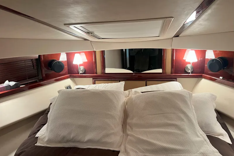 Elisabeth Jane Yacht Photos Pics Luxurious bedroom interior of 2008 Sea Ray 52 Sedan Bridge yacht with elegant lighting.