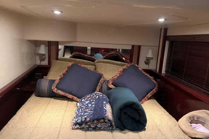 Elisabeth Jane Yacht Photos Pics Luxurious bedroom interior of 2008 Sea Ray 52 Sedan Bridge yacht with cozy bedding.