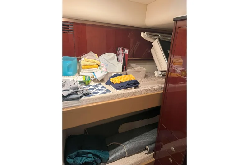 Elisabeth Jane Yacht Photos Pics Interior of 2008 Sea Ray 52 Sedan Bridge with assorted items on a shelf.