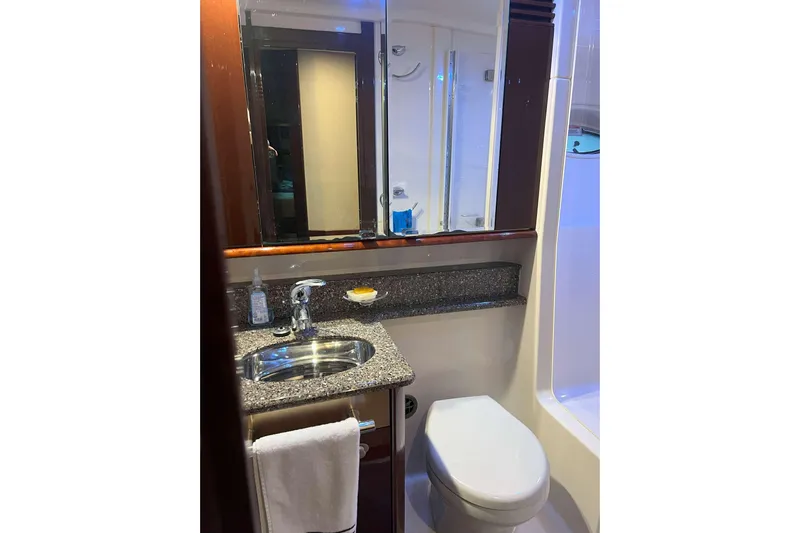 Elisabeth Jane Yacht Photos Pics Luxurious bathroom in 2008 Sea Ray 52 Sedan Bridge yacht, featuring granite countertop and modern fixtures.