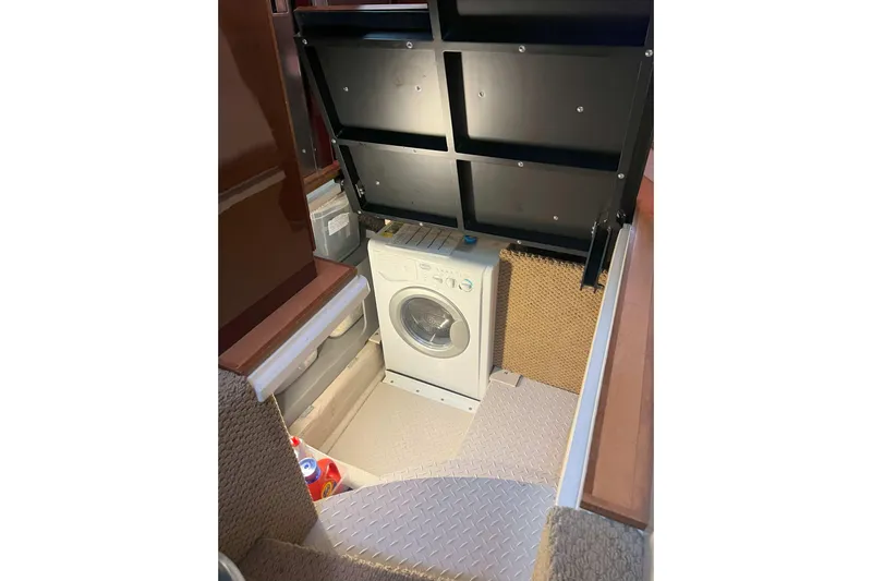 Elisabeth Jane Yacht Photos Pics Laundry area with washing machine on 2008 Sea Ray 52 Sedan Bridge yacht.