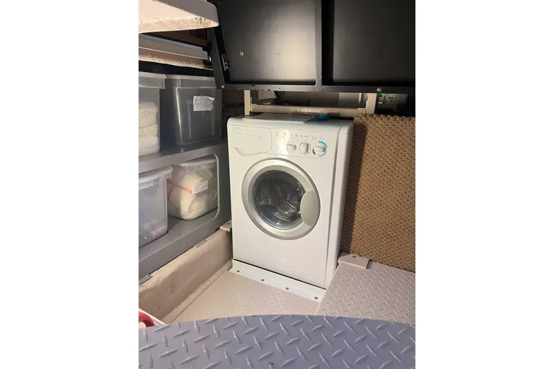 Elisabeth Jane Yacht Photos Pics Laundry area with washing machine on 2008 Sea Ray 52 Sedan Bridge yacht.