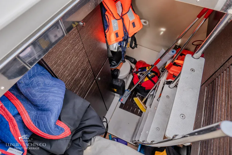  Yacht Photos Pics 2010 Azimut 62S yacht interior with life jackets and storage area.