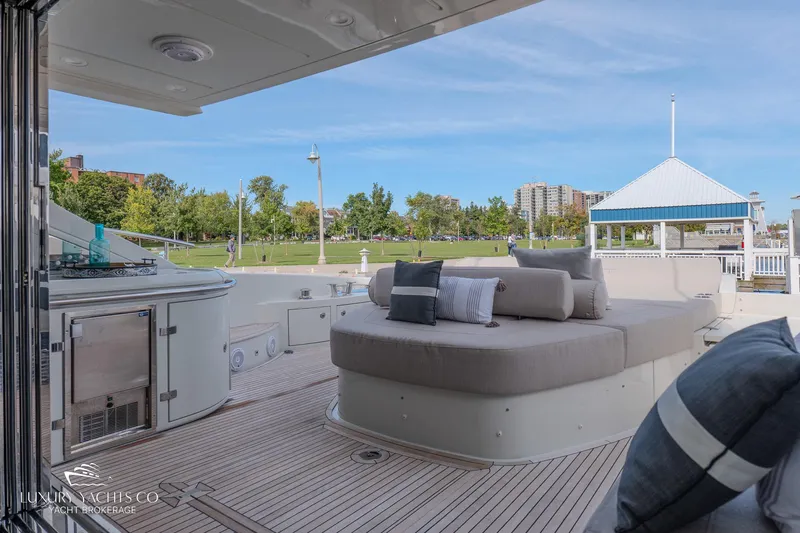  Yacht Photos Pics Luxurious 2010 Azimut 62S yacht deck with plush seating and scenic marina view.