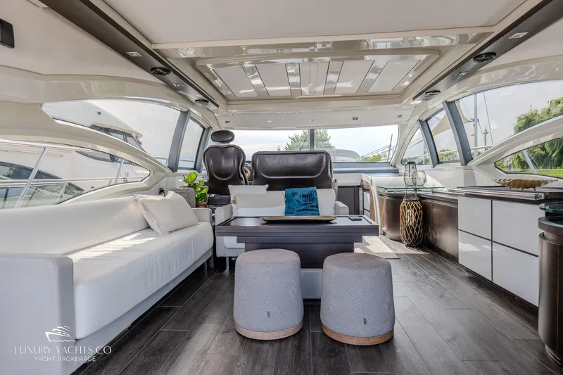  Yacht Photos Pics Luxurious interior of a 2010 Azimut 62S yacht with modern furnishings and panoramic windows.