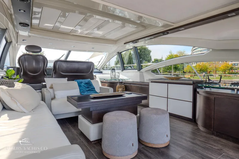  Yacht Photos Pics Luxurious interior of a 2010 Azimut 62S yacht with modern furnishings and panoramic windows.