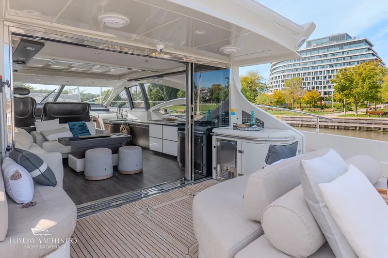  Yacht Photos Pics Luxurious 2010 Azimut 62S yacht interior with modern seating and scenic waterfront view.