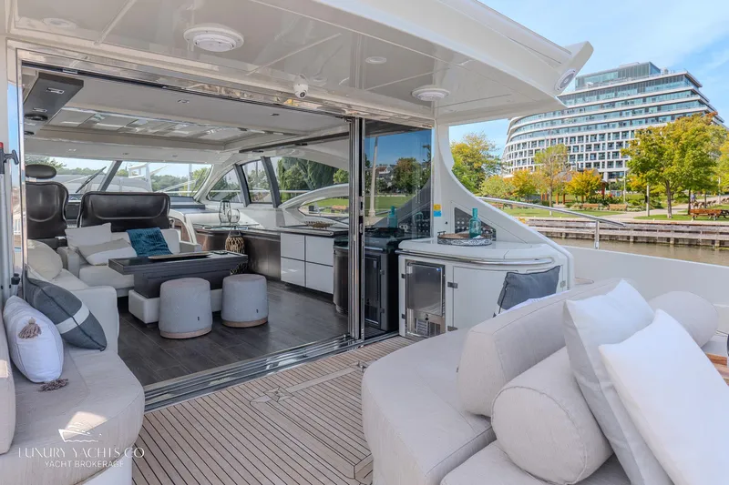  Yacht Photos Pics Luxurious 2010 Azimut 62S yacht interior with modern seating and scenic waterfront view.