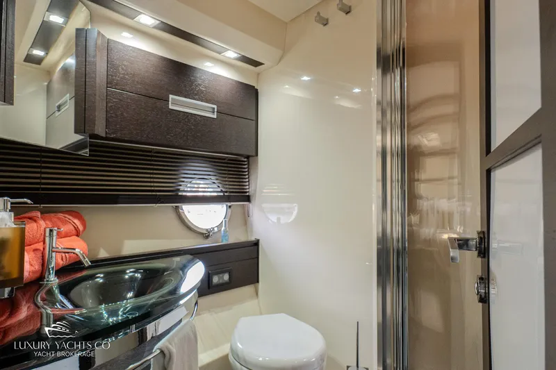  Yacht Photos Pics Luxurious bathroom in 2010 Azimut 62S yacht with modern fixtures and elegant design.