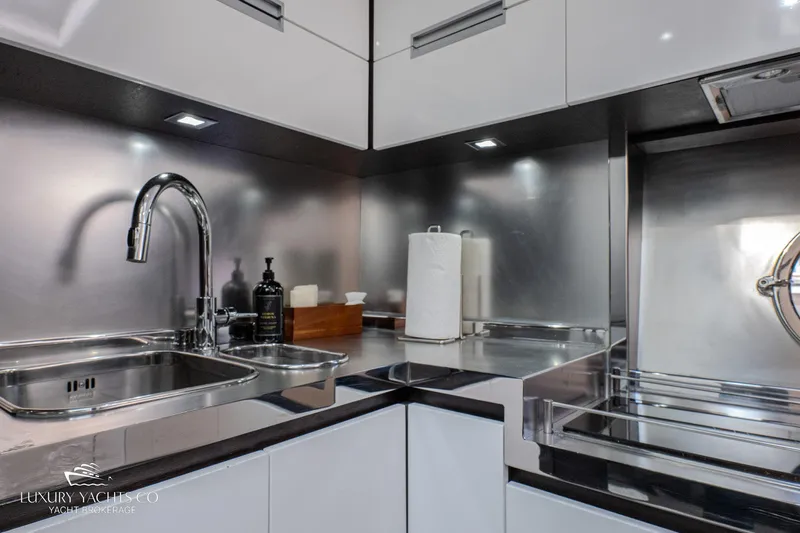  Yacht Photos Pics Modern kitchen in 2010 Azimut 62S yacht with sleek stainless steel fixtures.