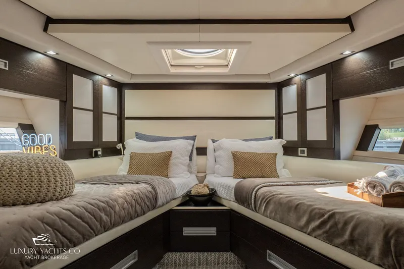  Yacht Photos Pics Luxurious bedroom interior of 2010 Azimut 62S yacht with twin beds and elegant decor.