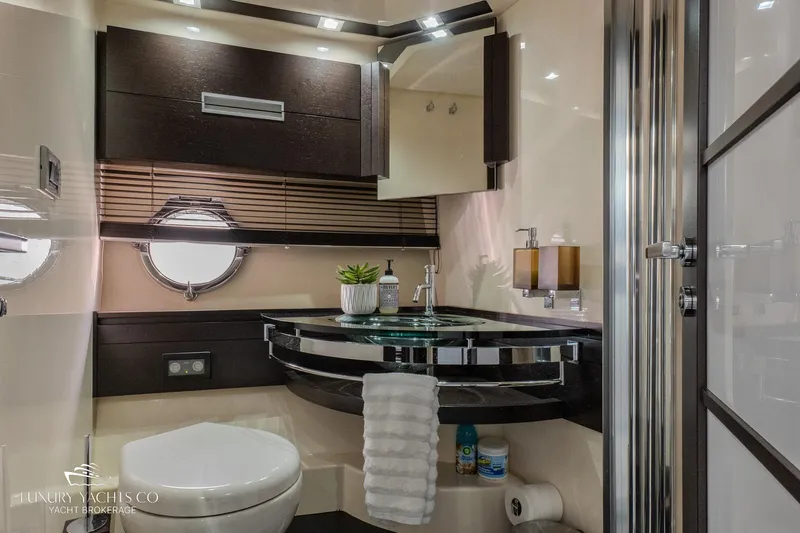  Yacht Photos Pics Luxurious bathroom interior of 2010 Azimut 62S yacht with modern fixtures and elegant design.