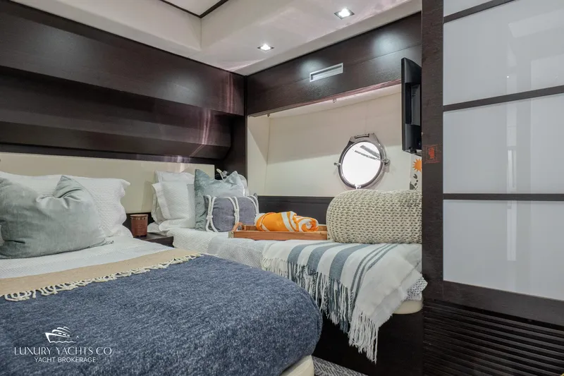  Yacht Photos Pics Luxurious 2010 Azimut 62S yacht bedroom with modern decor and cozy bedding.