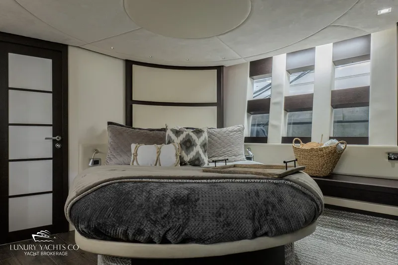  Yacht Photos Pics Luxurious bedroom interior of 2010 Azimut 62S yacht with modern design and cozy bedding.