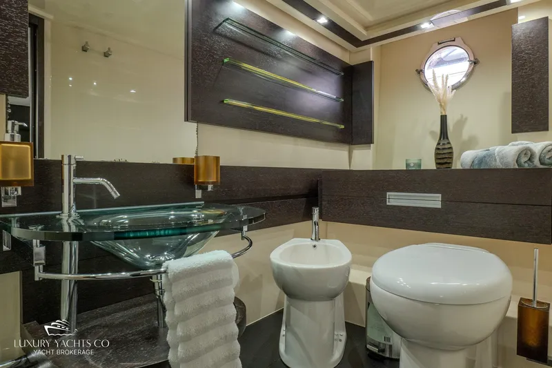  Yacht Photos Pics Luxurious bathroom in 2010 Azimut 62S yacht with modern fixtures and elegant design.