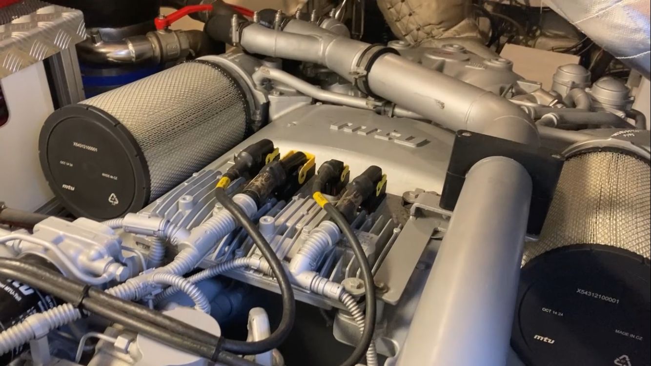 Engine room of a 2015 Pershing 70 with complex components.