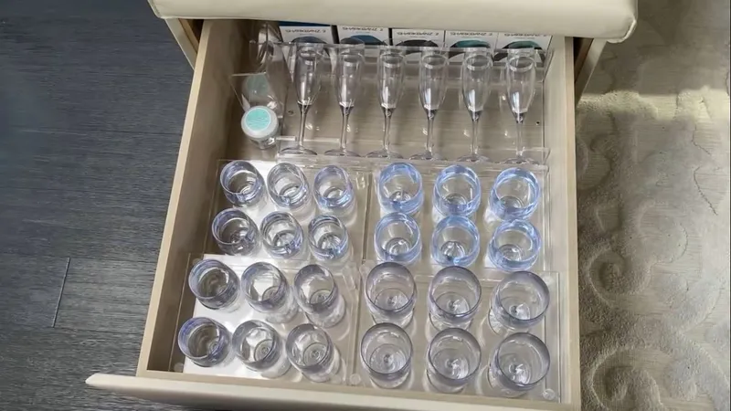 Rosario Yacht Photos Pics Glasses in a drawer on a 2015 Pershing 70 yacht.