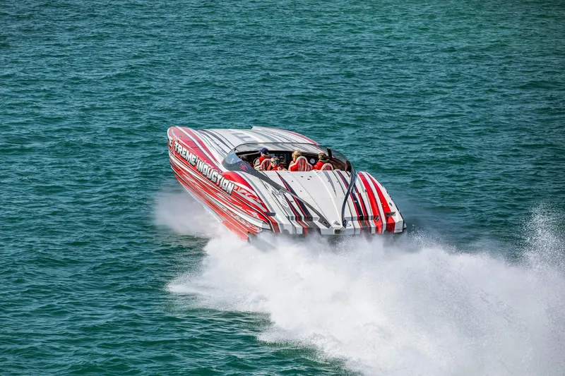  Yacht Photos Pics High-speed MTI 48 powerboat from 2019 racing on open water, creating a dramatic wake.