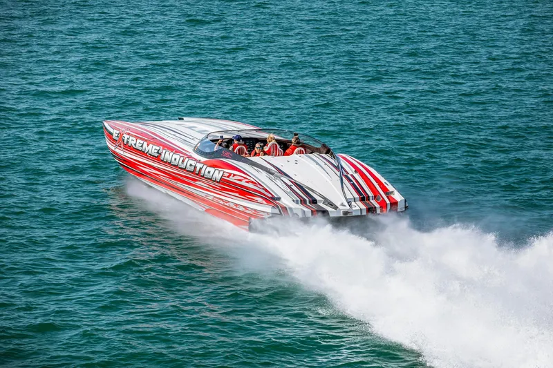  Yacht Photos Pics High-speed MTI 48 powerboat, 2019 model, with vibrant red and white design on open water.