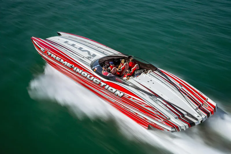  Yacht Photos Pics High-speed MTI 48 powerboat with red and white design on open water, 2019 model.