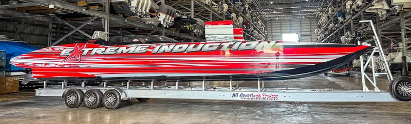  Yacht Photos Pics Red and white MTI 48 speedboat on trailer in warehouse, 2019 model.