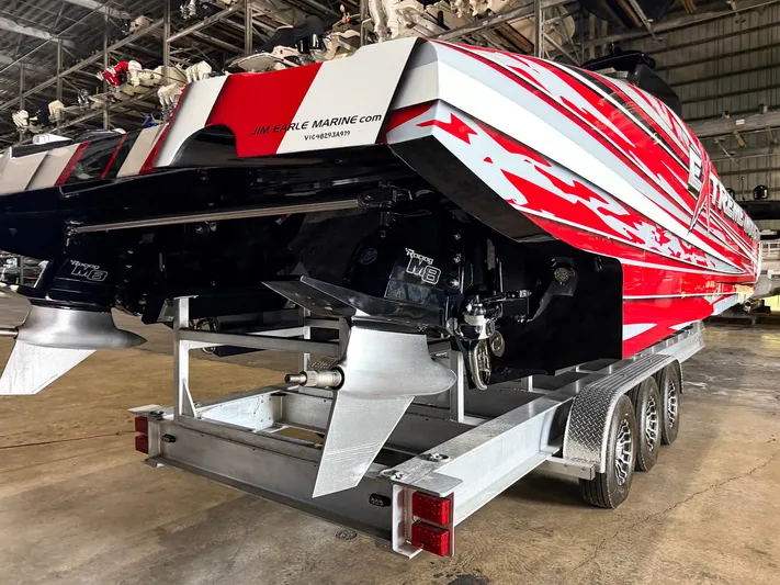  Yacht Photos Pics Red and white MTI 48 speedboat on trailer in warehouse, 2019 model.