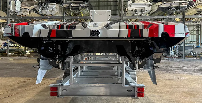  Yacht Photos Pics 2019 MTI 48 boat in storage, rear view showing dual propellers and vibrant design.