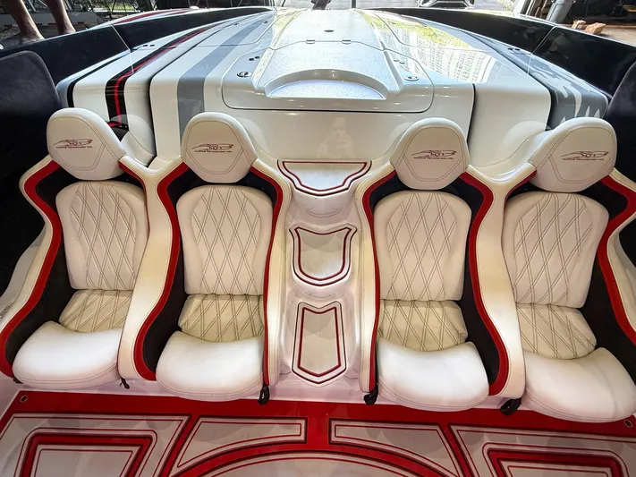  Yacht Photos Pics Luxurious MTI 48 boat interior with white and red diamond-stitched seats, 2019 model.
