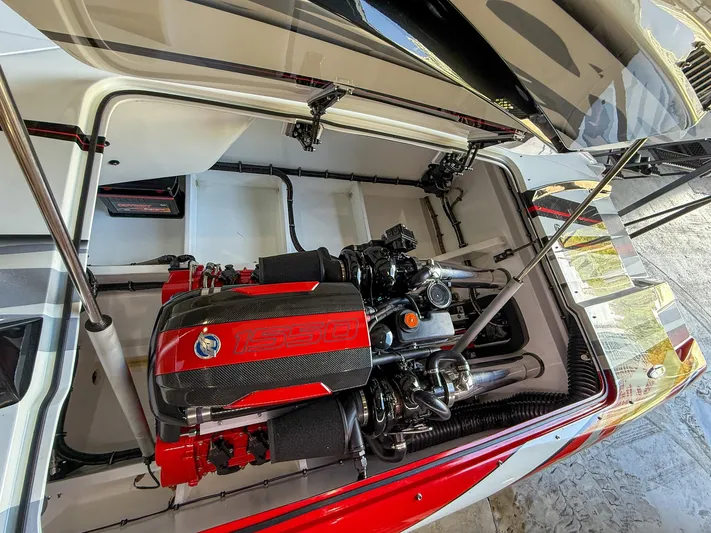  Yacht Photos Pics High-performance engine in a 2019 MTI 48 boat, featuring a striking red and black design.