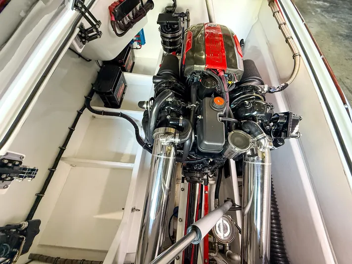  Yacht Photos Pics Engine compartment of a 2019 MTI 48 boat, featuring a powerful engine setup.
