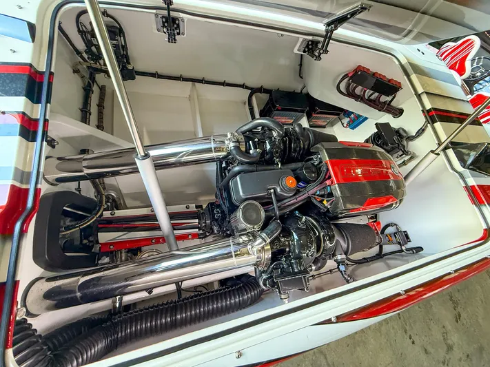  Yacht Photos Pics Engine compartment of a 2019 MTI 48 boat, showcasing detailed mechanical components.