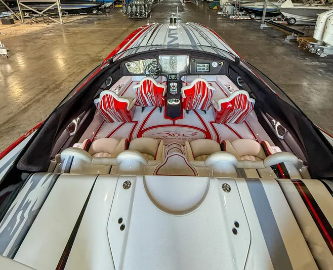  Yacht Photos Pics Interior of a 2019 MTI 48 boat with red and white seating.
